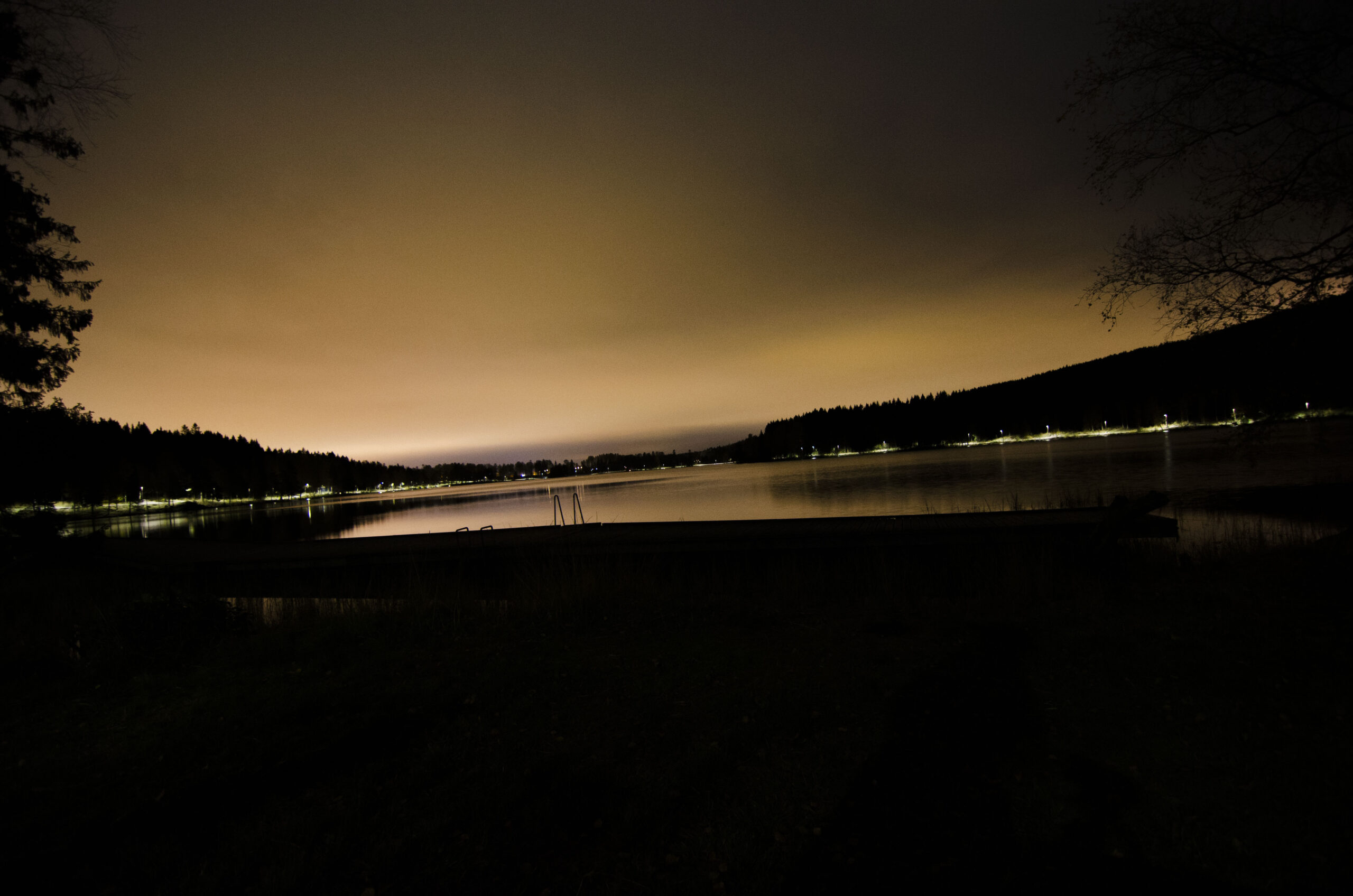 A view of the sognsvann lake at night with light pollution of Oslo